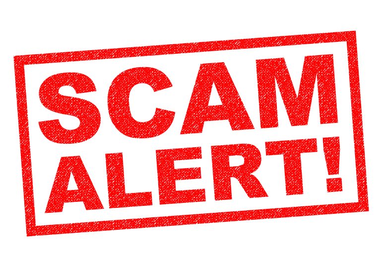 SCAM ALERT! red Rubber Stamp over a white background.