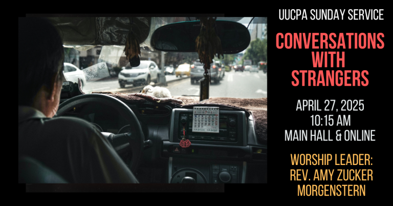 A view of a taxi driver and the front seat of the taxi, from the back seat